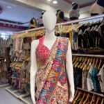 Beige Floral Designer Saree with Multicolour Traditional Printed Border